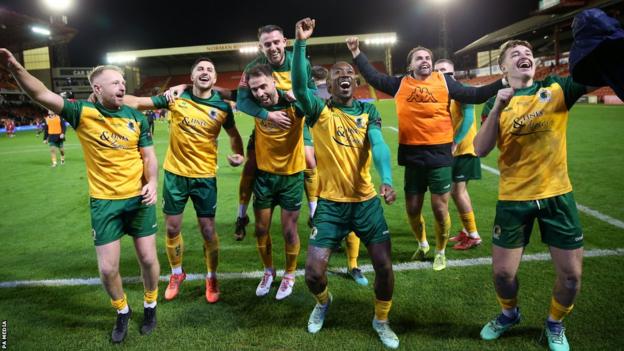 Horsham players celebrate after earning a replay against Barnsley
