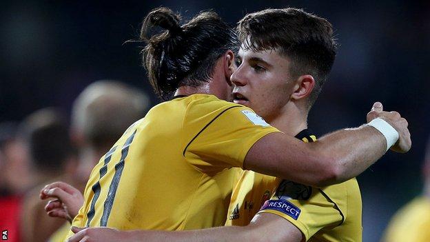 Ben Woodburn is congratulated by fellow Wales forward Gareth Bale after the Moldova win