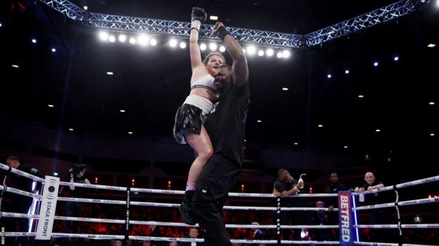 Sandy Ryan celebrates with her trainer Clifton Mitchell