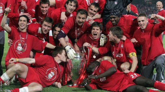 Liverpool players celebrate with the Champions League title