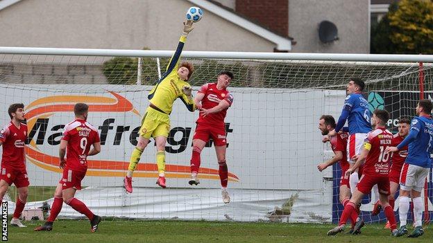 Portadown keeper Jacob Carney at full stretch to tip over against Linfield