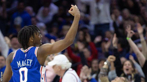 Philadelphia 76ers guard Tyrese Maxey (0) reacts after his three pointer against the Cleveland Cavaliers during the fourth quarter at Wells Fargo Center.