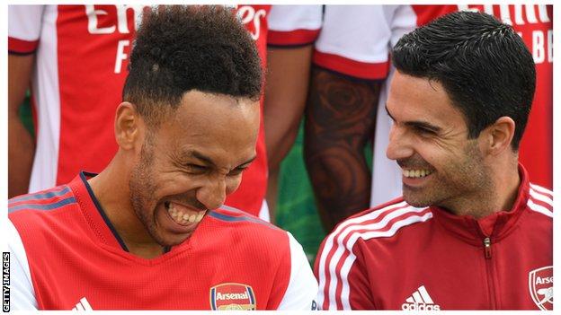 Pierre-Emerick Aubameyang and Mikel Arteta both laugh during photographs at Colney.