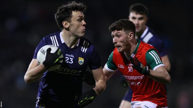 David Clifford attempts to get past Mayo's Fionn McDonagh after being introduced as a substitute in Castlebar