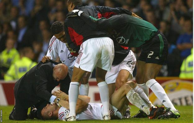 Andriy Shevchenko celebrates beneath his AC Milan team-mates after scoring the decisive penalty in a shoot-out for the 2003 Champions League