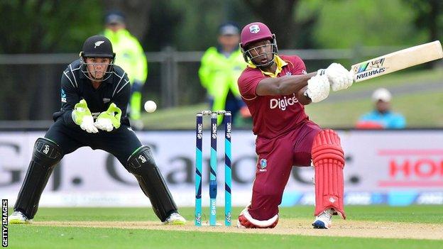 New Zealand wicketkeeper Tom Latham and West Indies' Rovman Powell