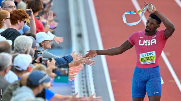 Fred Kerley celebrates with the crowd after winning world 100m gold