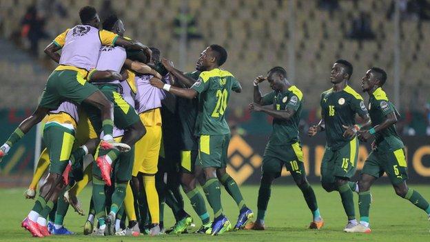 Senegal celebrate scoring against Burkina Faso