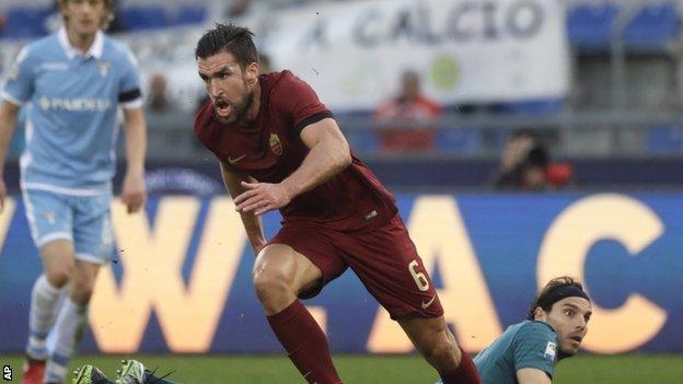 Kevin Strootman celebrates after giving Roma the lead against Lazio