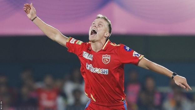 Punjab Kings' Nathan Ellis celebrates taking the wicket of Jos Buttler of Rajasthan Royals in the Indian Premier League