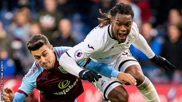 Renato Sanches leaps and shouts as he is tackled