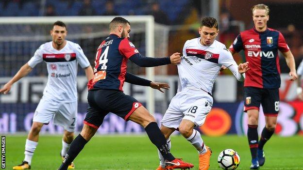 Nicolo Barella of Cagliari tries to get past Davide Biraschi of Genoa