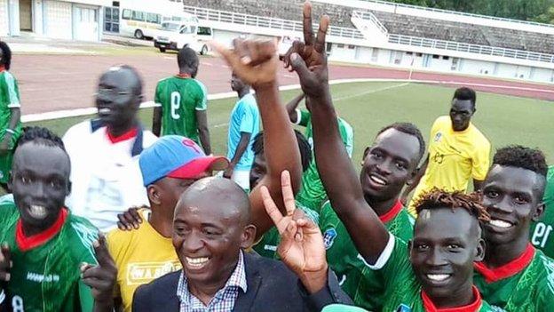 South Sudan coach Ashu Cyprian Besong celebrates with his players