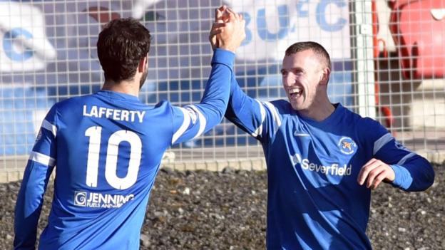 Johnny Lafferty congratulates Ryan Campbell who scored the second of Ballinamallard's three goals against Portadown at Shamrock Park