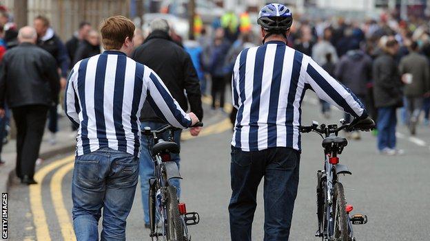 Fans cycling to match