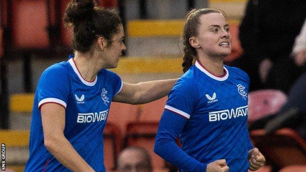 Rangers' Kirsty Howat (R) celebrates her goal to make it 1-0 during a Park's Motor Group Scottish Women's Premier League match between Celtic and Rangers at Excelsior Stadium