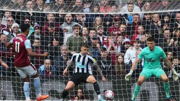 Ollie Watkins scores Aston Villa's third goal in a 3-0 win over Newcastle United in the Premier League