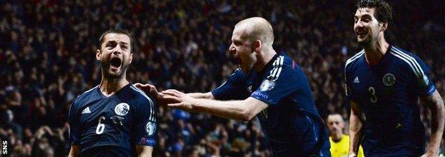 Shaun Maloney (left) celebrates scoring for Scotland with Steven Naismith and Charlie Mulgrew