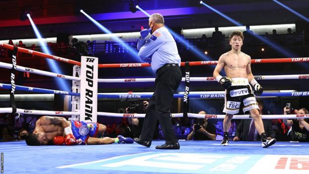 Naoya Inoue walks away with his opponent unconscious on the canvas