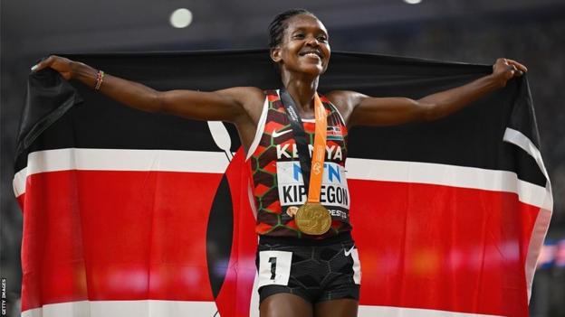 Kenya's Faith Kipyegon celebrates winning a gold medal at the World Athletics Championships in Budapest in August