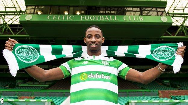 Moussa Dembele with a Celtic scarf