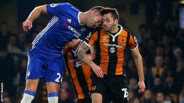 Ryan Mason is injured in a challenge with Gary Cahill
