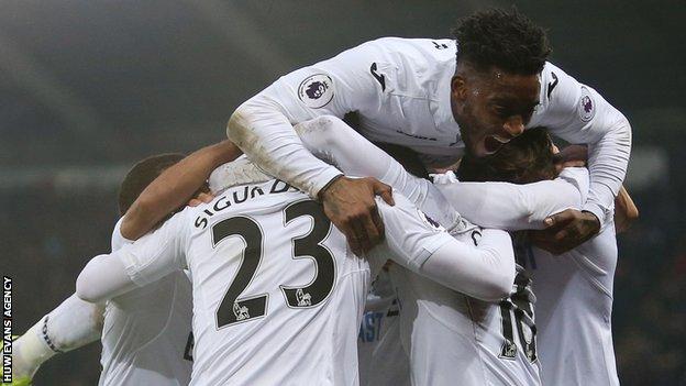 Swansea City celebrate a goal against Leicester City