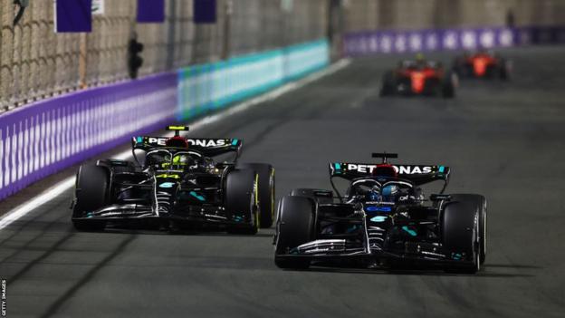 2-Time Formula One World Champion Lewis Hamilton sporting a signed