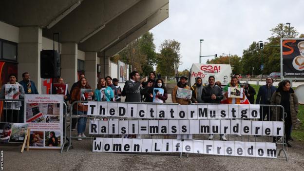 Iranians protesting against the country's government gather in Vienna outside the stadium hosting Iran v Senegal