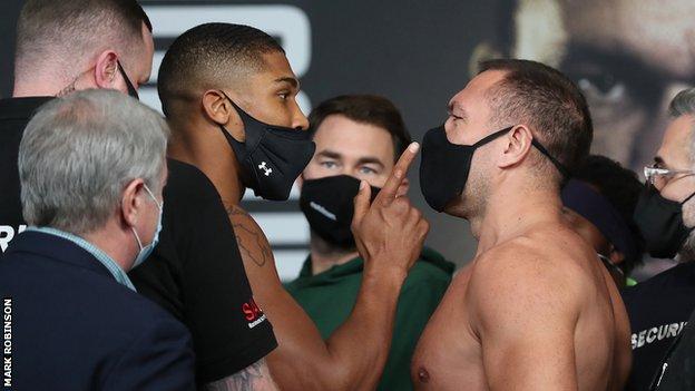 Pulev (right) drew a reaction from the unified world heavyweight champion as Joshua wags a finger