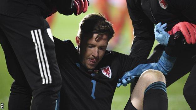Wales goalkeeper Wayne Hennessey had to be replaced injured after 79 minutes in Sofia