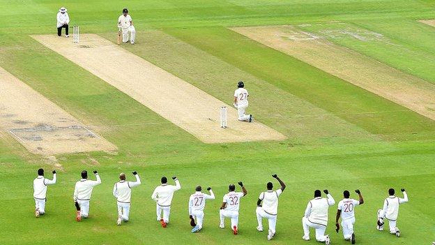 England and the West Indies take a knee before the start of a Test match