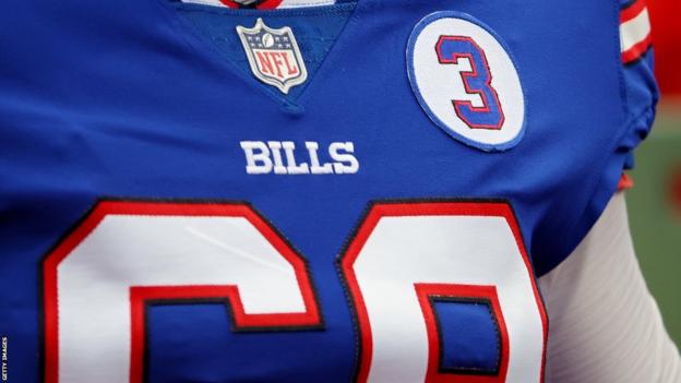 A Buffalo Bills player wears a number three patch on his jersey to support Damar Hamlin