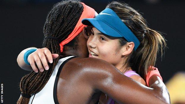 Coco Gauff and Emma Raducanu embrace at the 2023 Australian Open