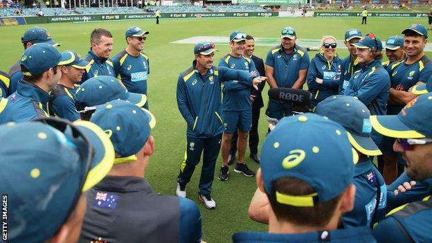 Australia coach Justin Lanager talks to his players