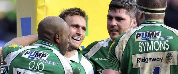 London Irish celebrate a try against Worcester