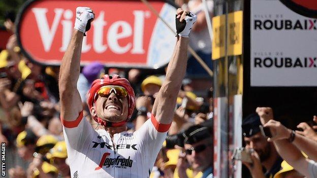John Degenkolb celebrates by putting his two fists up after taking the win on stage nine