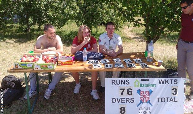 The scorers take shelter from the Balkan sun