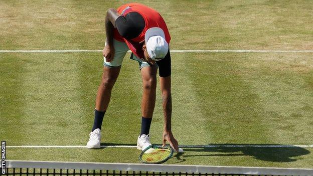 Nick Kyrgios smashes his racquet