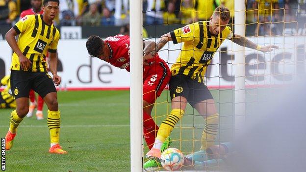 Marco Reus scores for Borussia Dortmund against Bayer Leverkusen