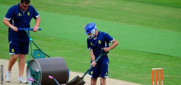Groundsman prepare a pitch at Edgbaston