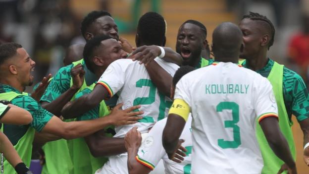 Senegal midfielder Pape Gueye celebrates scoring his team's first goal during the Africa Cup of Nations (CAN) 2024 group C football match between Senegal and Gambia