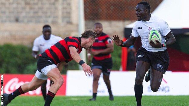 Collins Injera (right) in action for Kenya