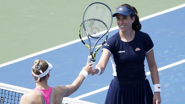 Johanna Konta taps racquets with Vera Zvonareva after their Western and Southern Open match