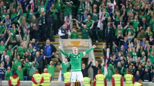 Steven Davis celebrates qualifying for the Euro 2016 finals