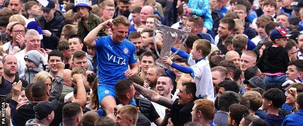 Stockport's Ben Whitfield celebrates promotion with fans