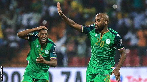 Ahmed Mogni (right) celebrates a goal against Ghana