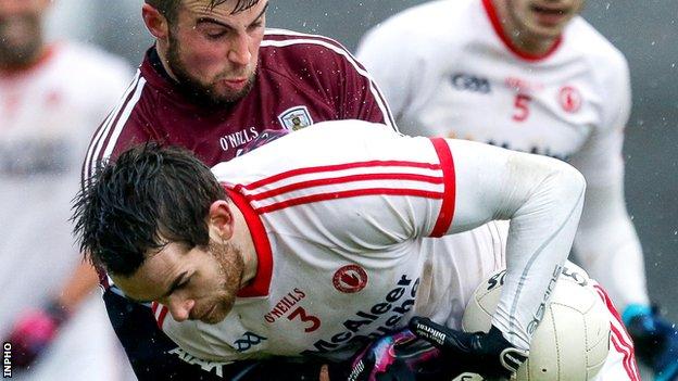 Galway's Paul Conroy puts in a challenge on Tyrone defender Ronan McNamee at Salthill