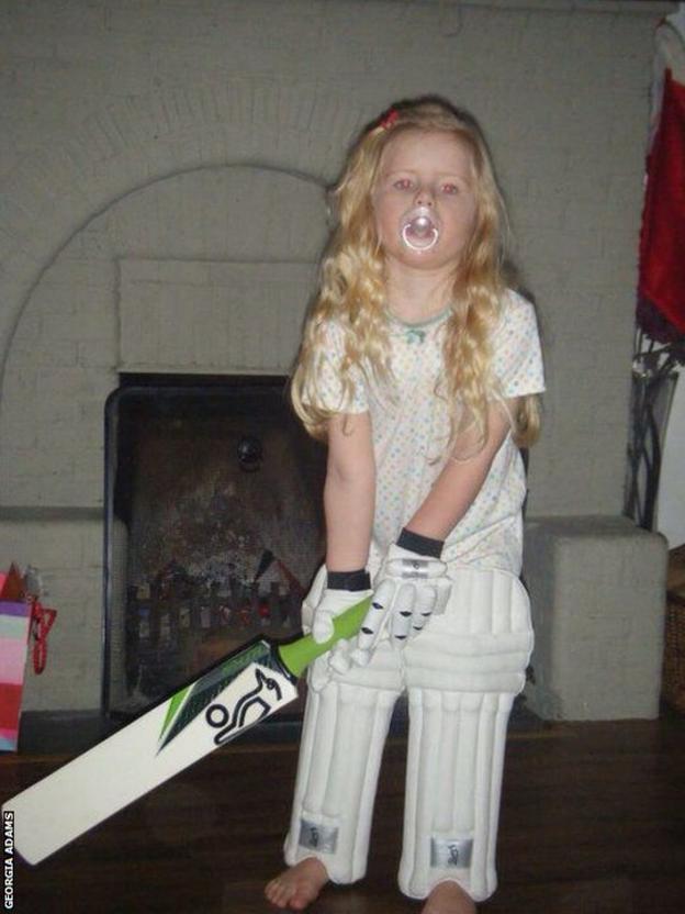 Mollie Adams with a dummy and bat
