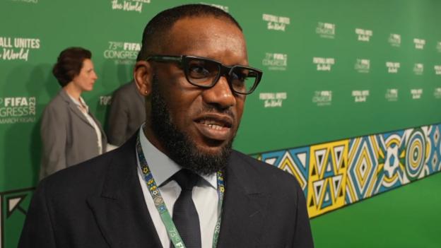 Jay-Jay Okocha answering questions during an interview at the 73rd FIFA Congress in Kigali, Rwanda.